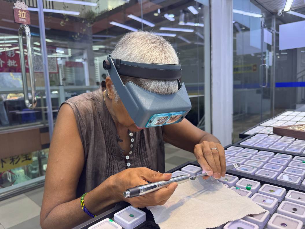 Kim Rix Examining Gemstones Sri Lanka