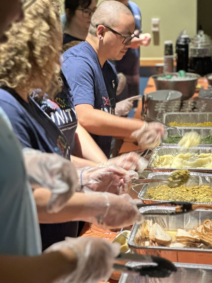 UNITY team serving Thanksgiving food in 2024